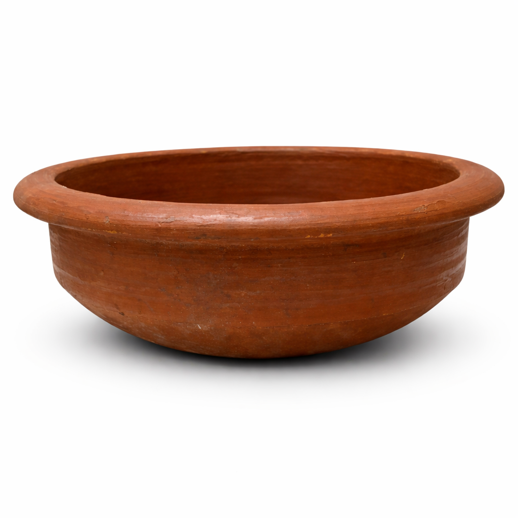 Red clay pot used for slow-cooking sarson ka saag